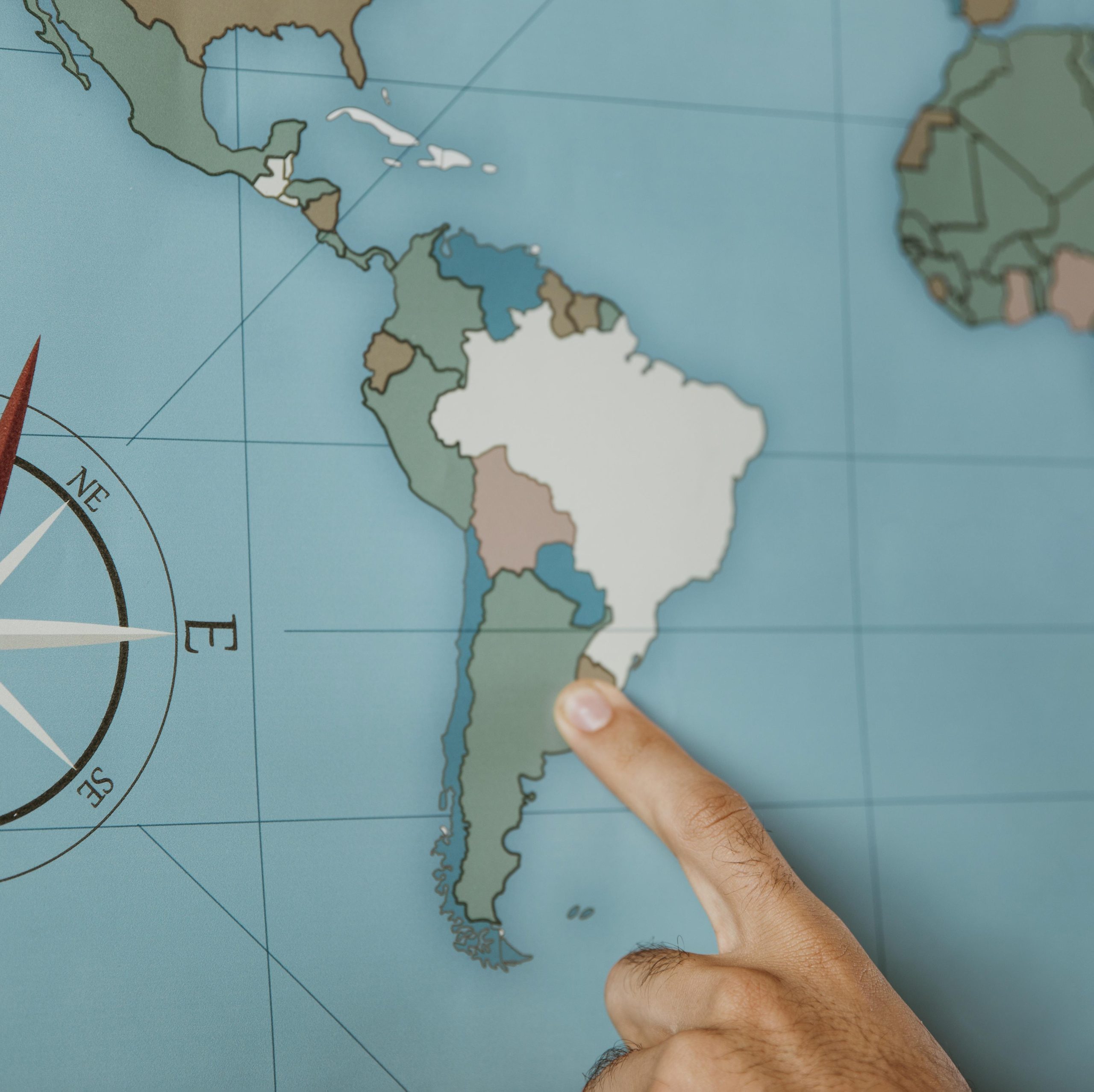 person-pointing-south-america-map